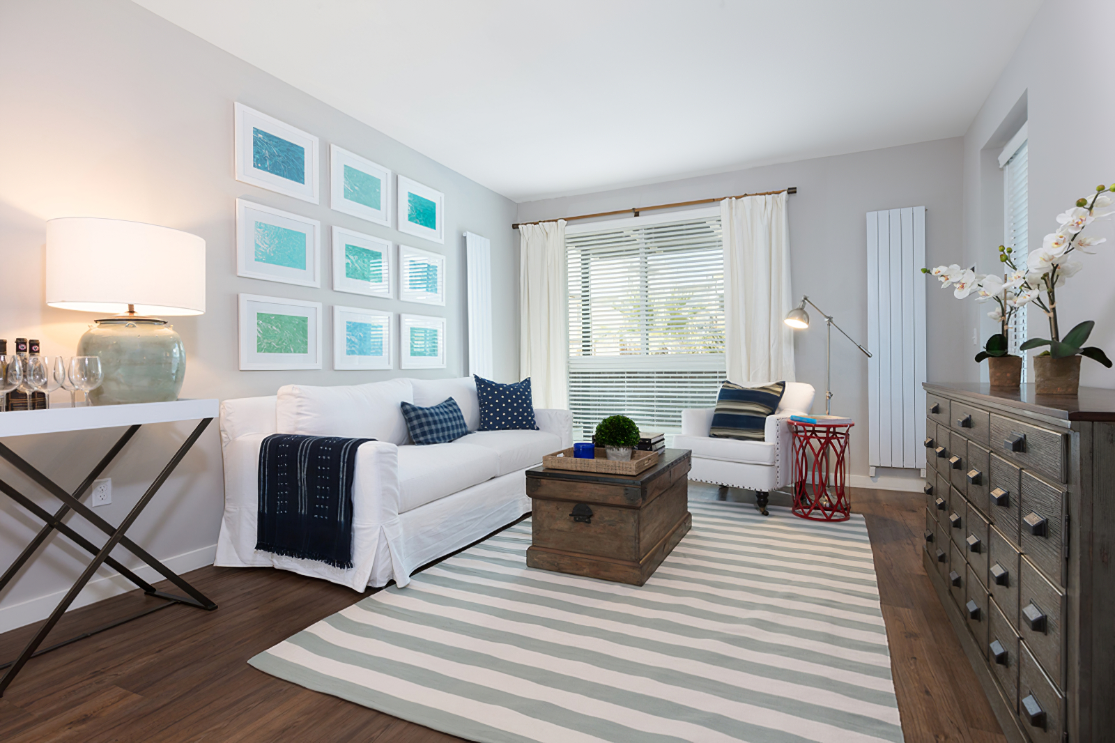 living room with large window and decor