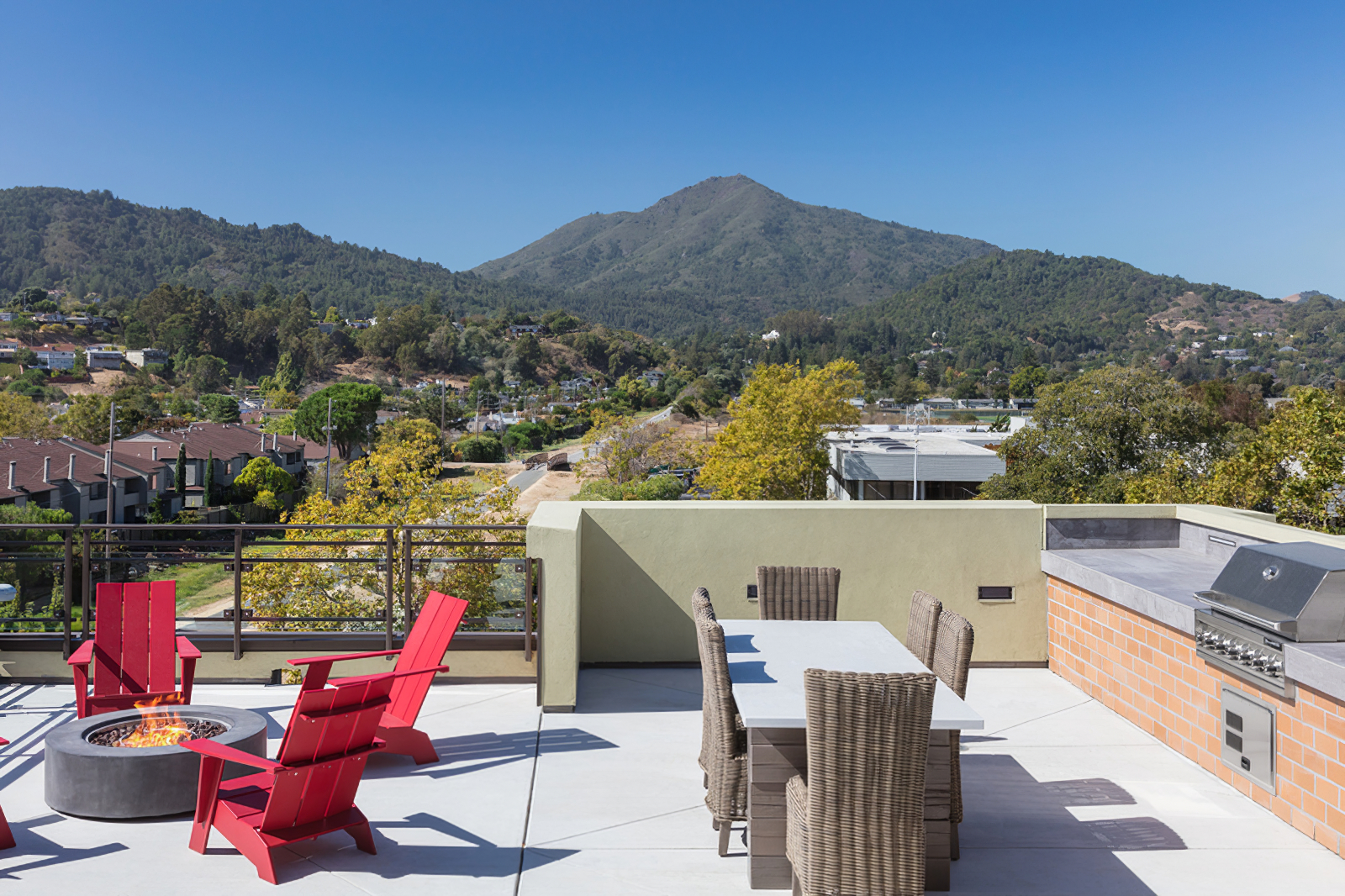 Rooftop lounge view with fire pit and seating